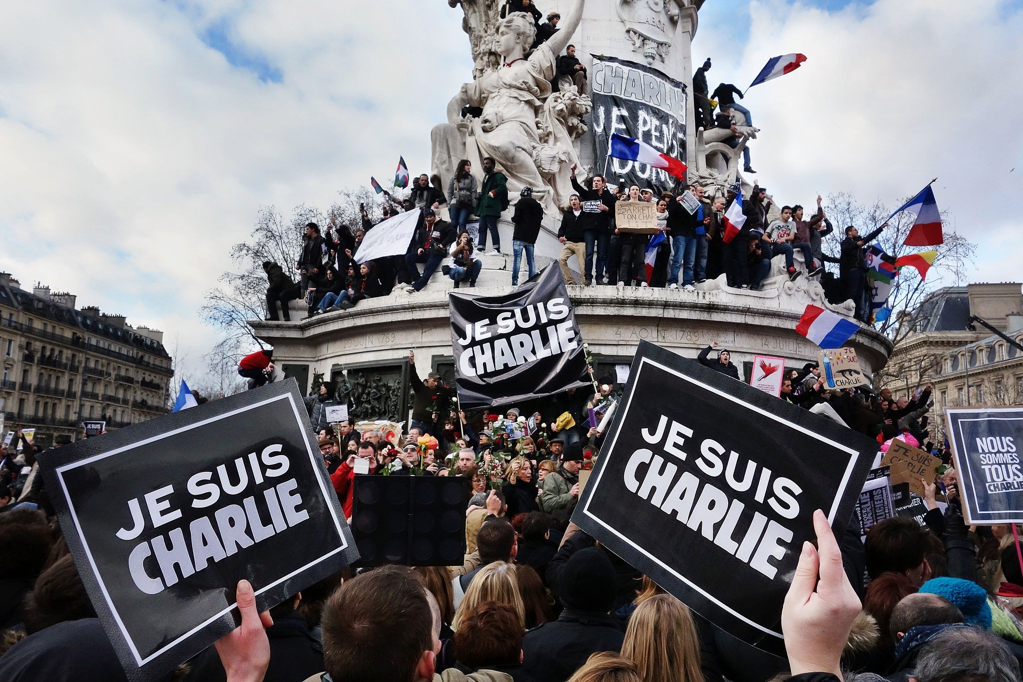 Rally in support of the Charlie Hebdo victims, Place de la Republique, January 2015. 2048px-Je_suis_Charlie,_Paris_11_January_2015__3_