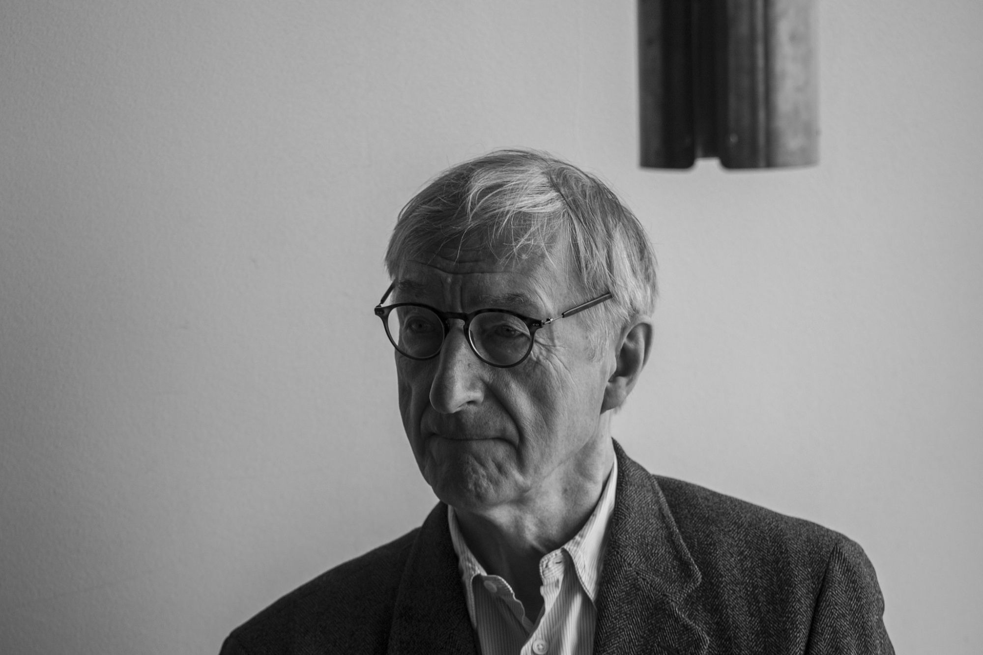 A black and white headshot of Julian Barnes
