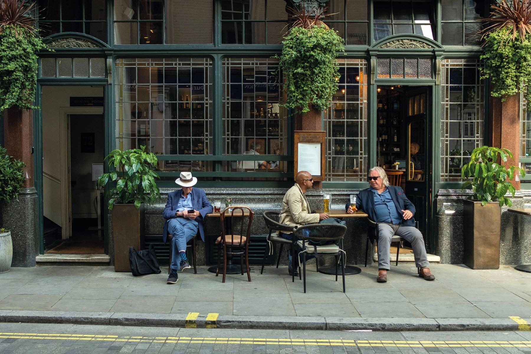Patrons outside a busy pub in the Yorkshire Dales. Credit: Alamy Patrons outside a pub in the Yorkshire Dales