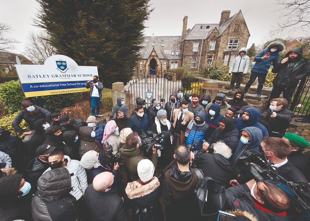 Protesters give a statement outside Batley Grammar School in West Yorkshire, March 2021 Batley Grammar School in West Yorkshire