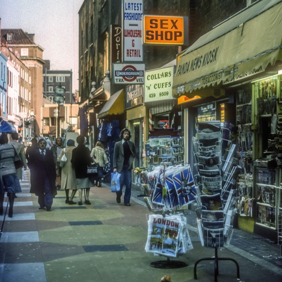 London's Soho in 1976 A man strolls past a sign reading 'Sex Shop' in Soho, 1976