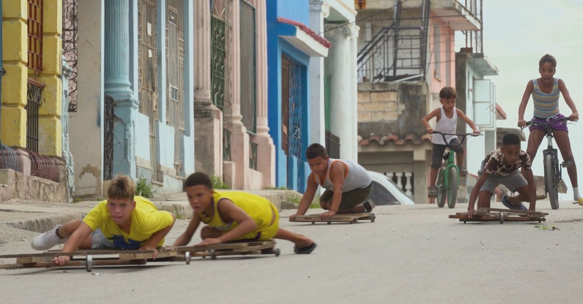 Children play in Havana, Cuba, in this still from “Children’s Game #40: Chivichanas” from the “Children’s Games” series by Francis Alÿs In a still from the “Children’s Games” series, children in Havana, Cuba play 'chivichanas', skating perilously down a hill on makeshift sledges