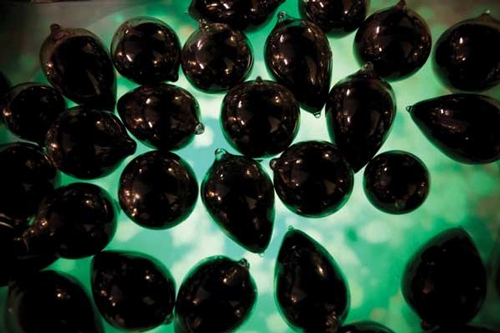 Kathy High – 'Blood Wars'. Glass globes filled with pigs' blood over a video representation of the Blood Wars battle (filmed through time lapse microscopy)