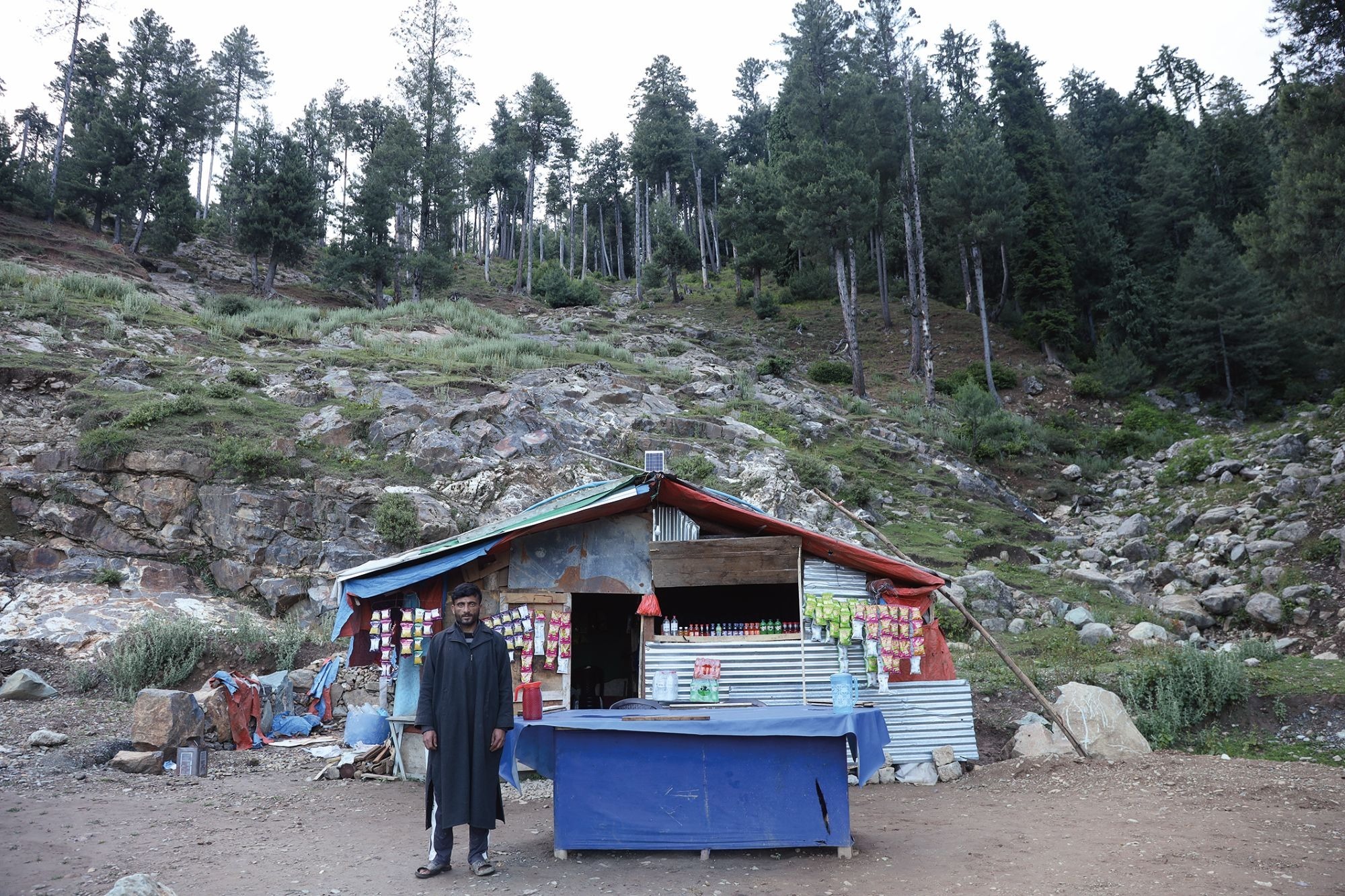 Mushtaq Ahmad Khan by his tea stall. Credit: Durdana Bhat Mushtaq Ahmad Khan by his tea stall