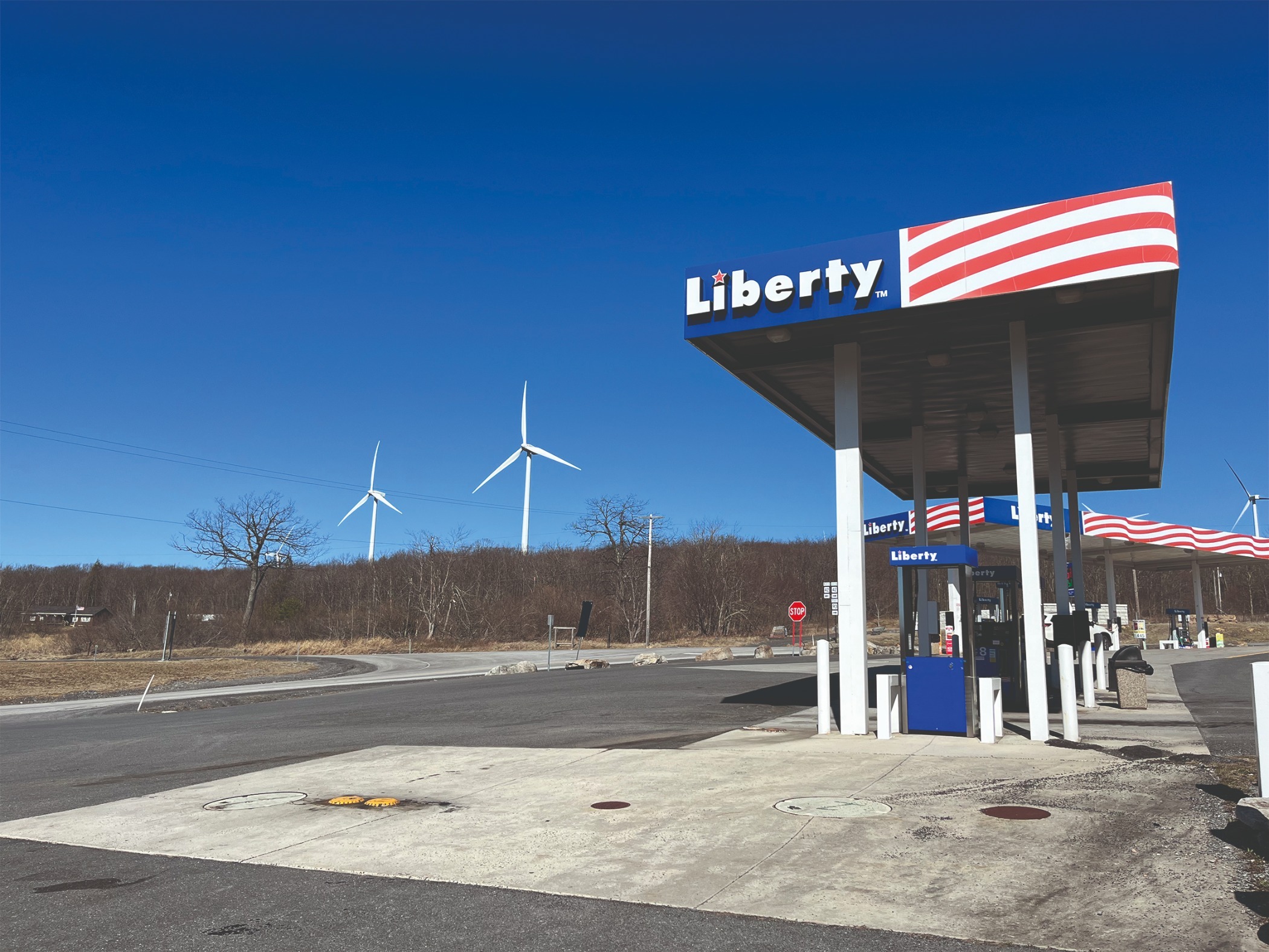 Liberty Gas Station, Mount Storm. Credit: Dominic Hinde A photo shows a gas station with wind turbines behind it in Mount Storm