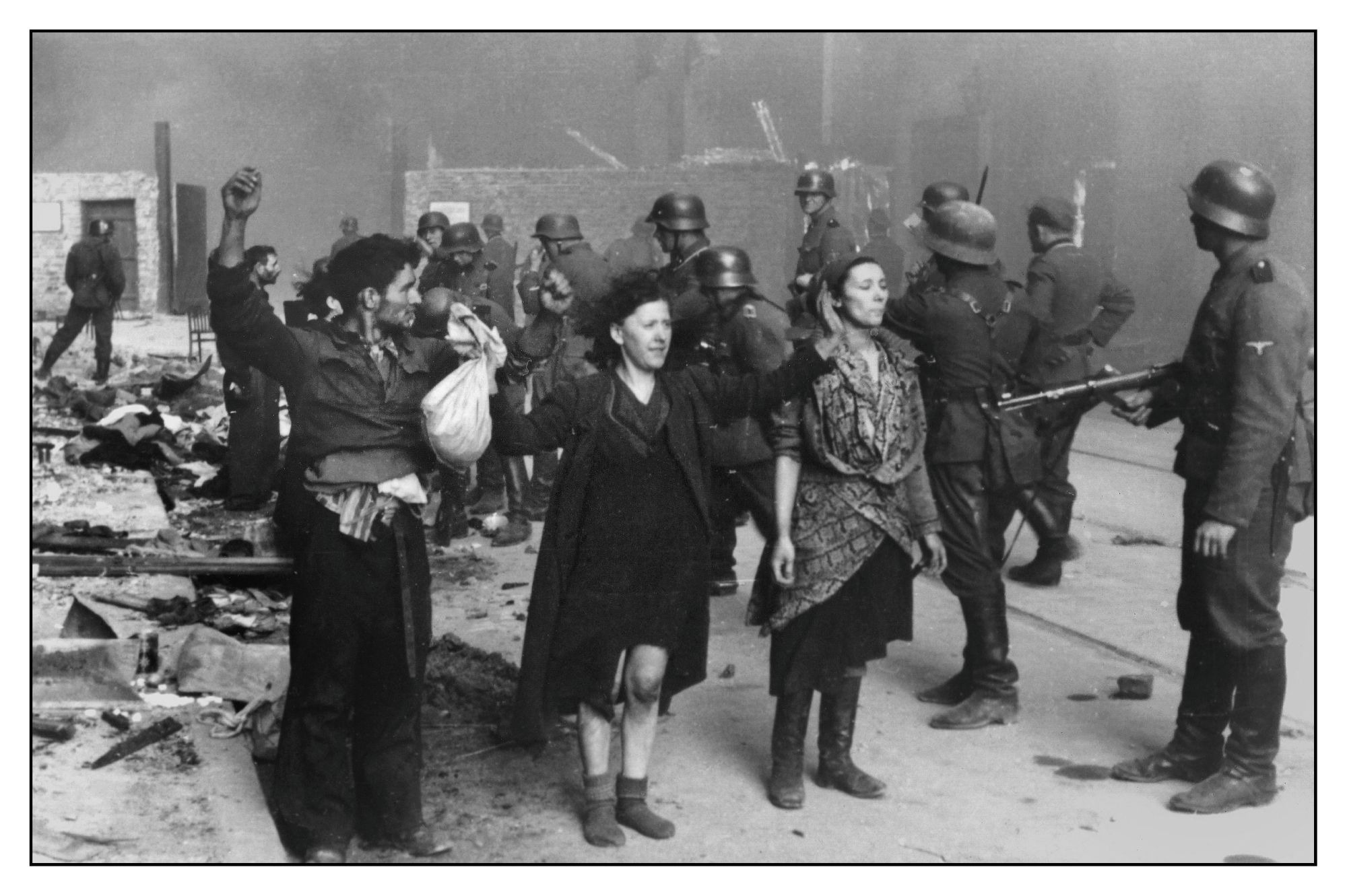 Polish Jews stand in defiance of the Nazi troops in the Warsaw Ghetto, 1943. Credit: Alamy Polish Jews stand in defiance of the Nazi troops in the Warsaw Ghetto, 1943
