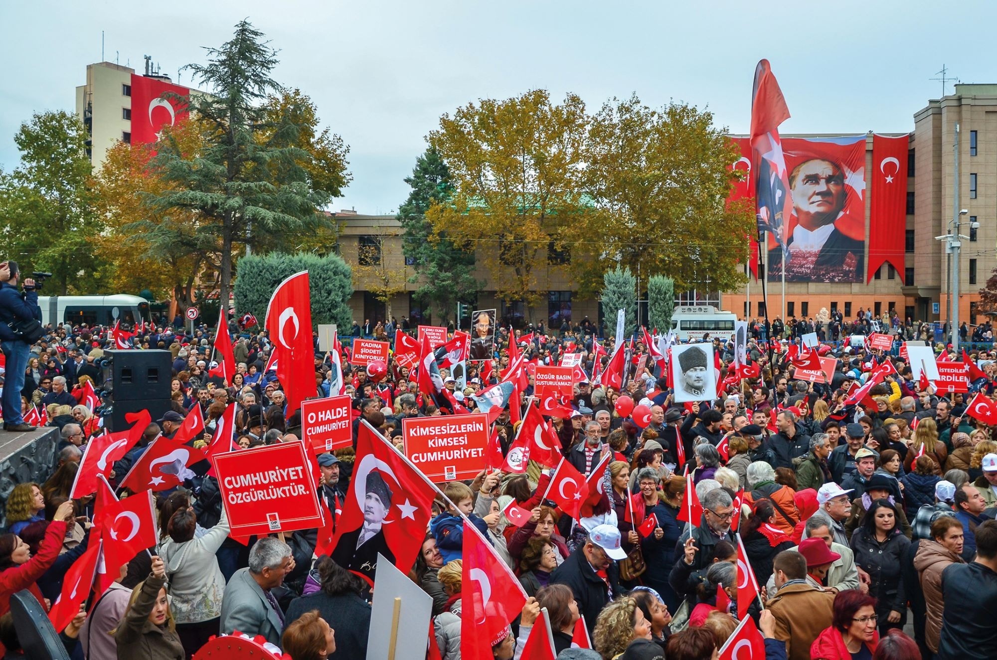Republic Day celebrations in Turkey. Credit: Alamy A crowd of people wave flags and banners as they celebrate Republic Day in Turkey