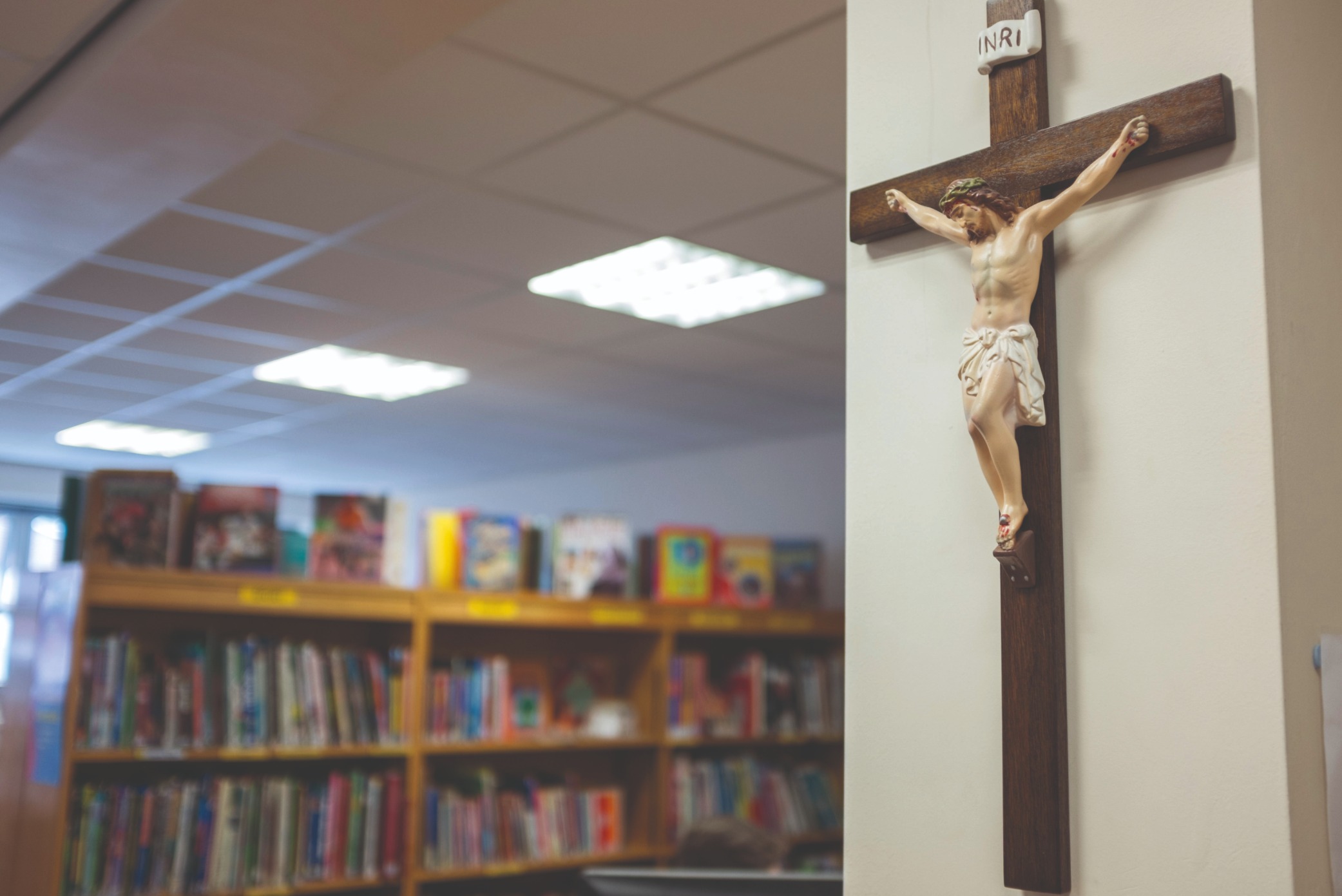 A crucifix hangs on the wall of a Catholic school in Warwickshire in the UK (Alamy Stock Photo) Crucifix in a classroom