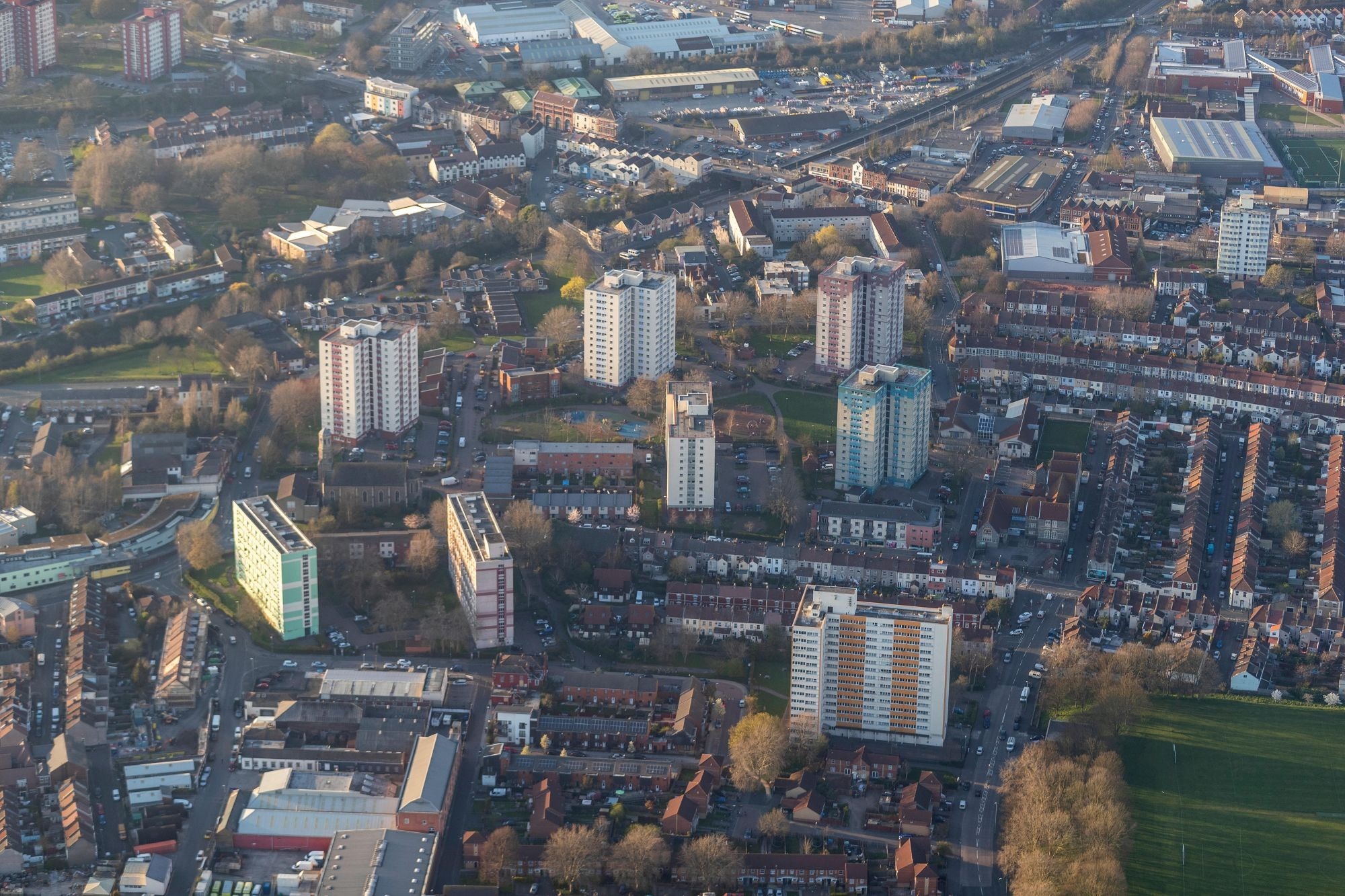 An aerial view of several tower blocks and buildings making up the Barton Hill flats and estate in Bristol