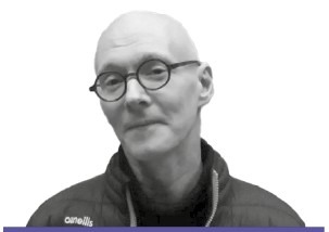 A headshot of Tony Milligan