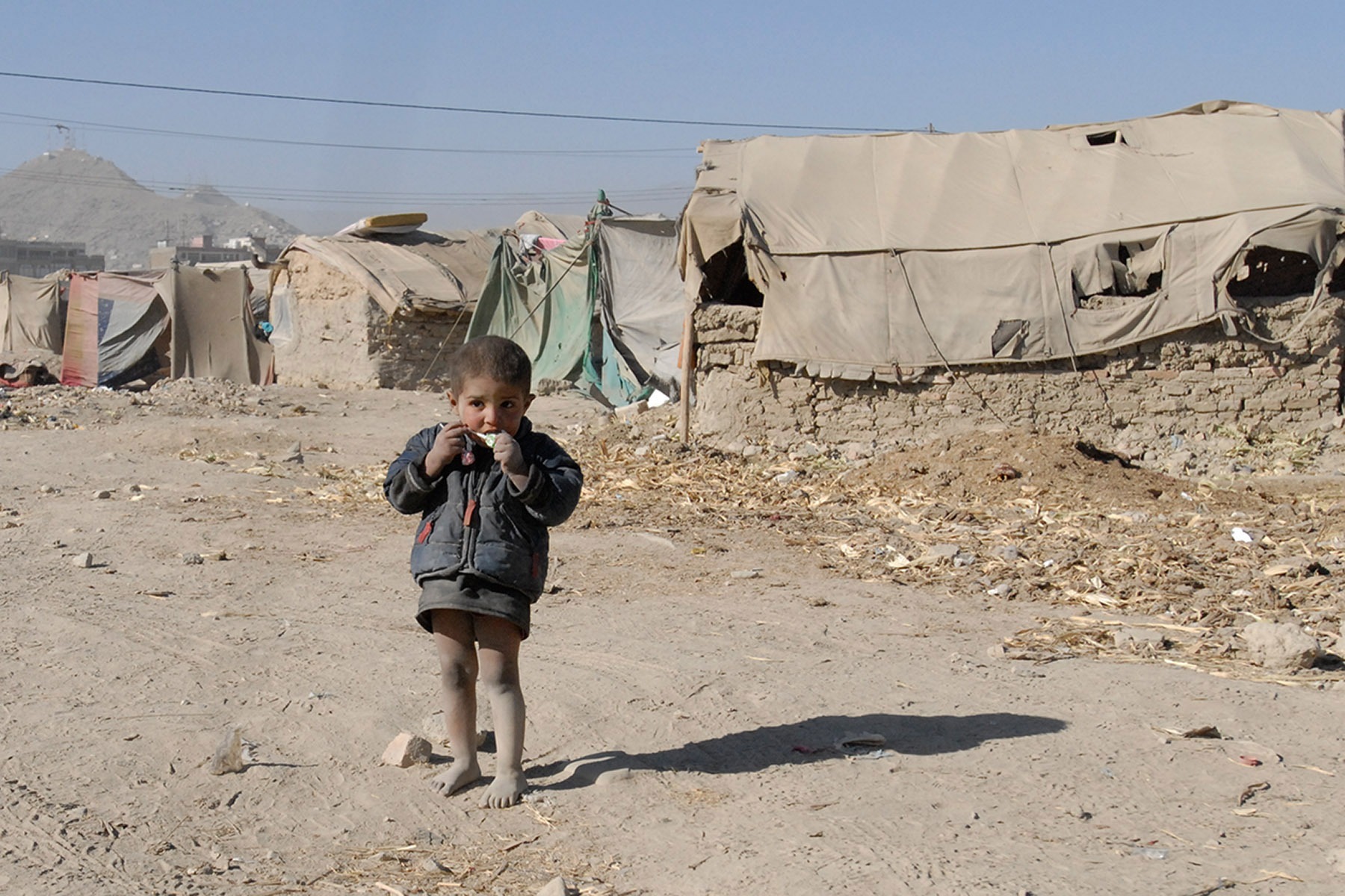 A young Afghan child at a refugee camp in Kabul, 2010. Image: Flickr/DVIDSHUB afghan2