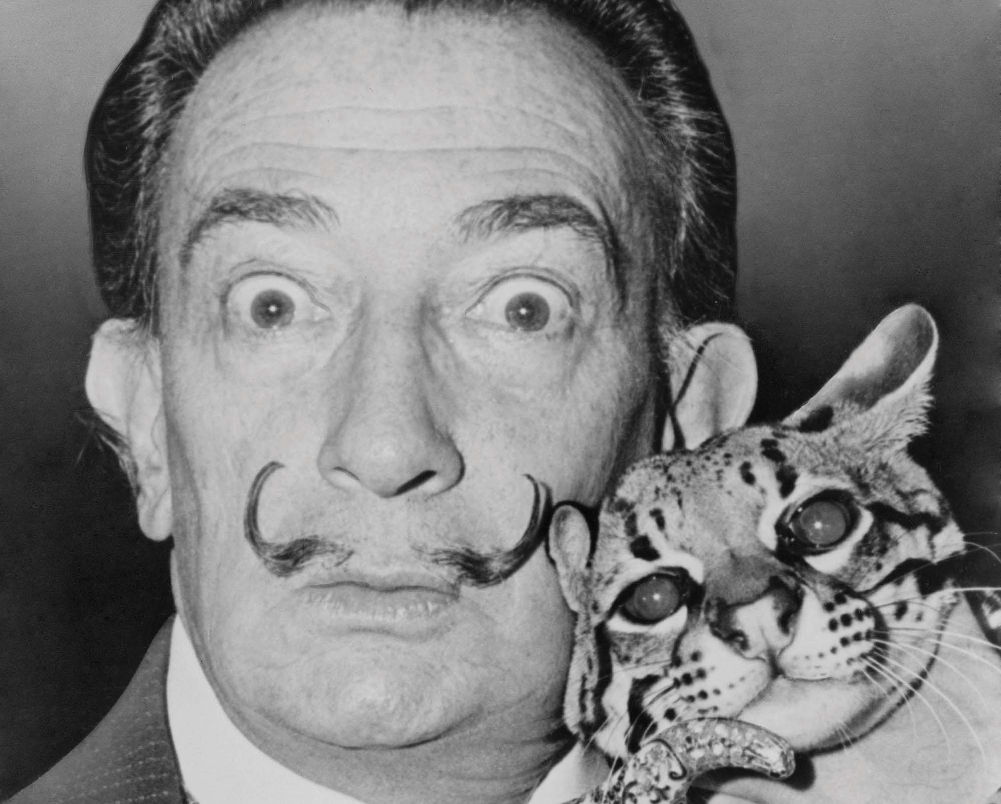 Salvador Dalí with his pet ocelot animals