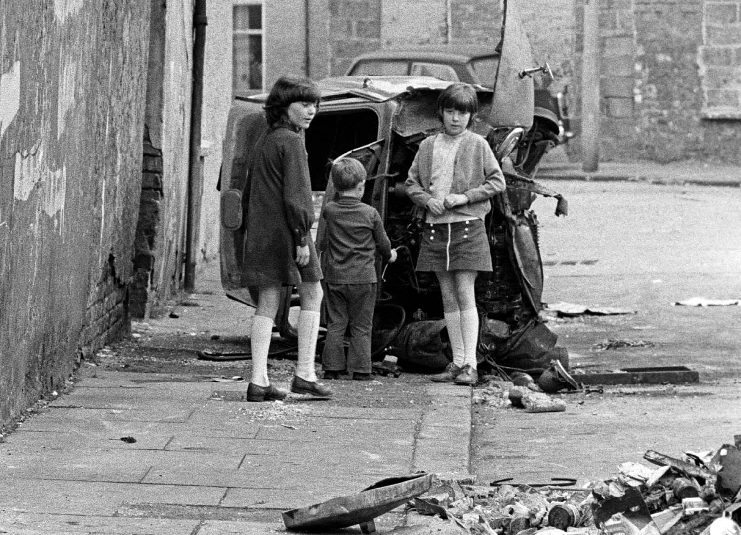 Children playing in a deserted part of Belfast in the 1970s Belfast