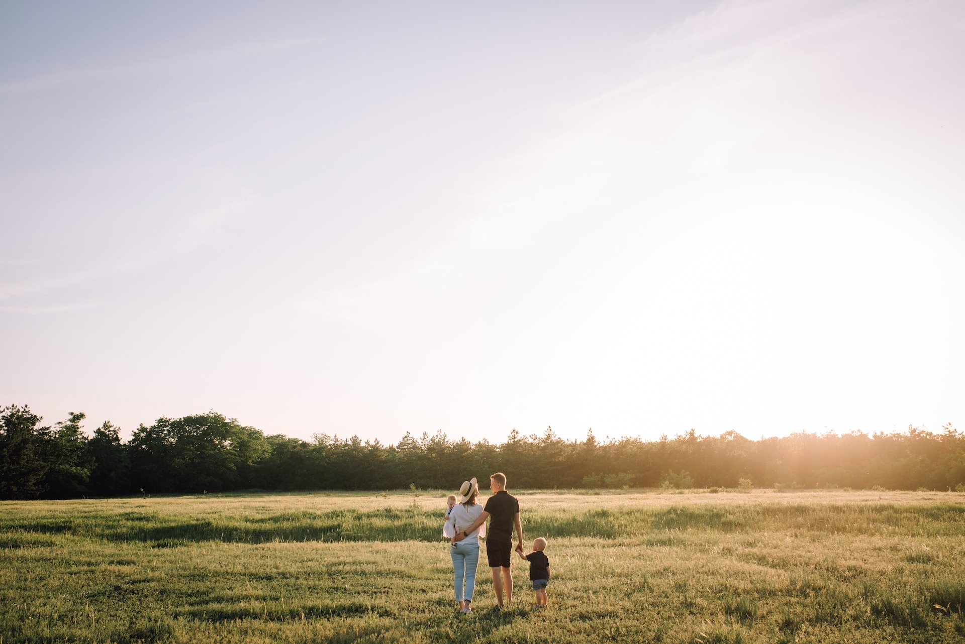 A stock image of a man and a woman with two children