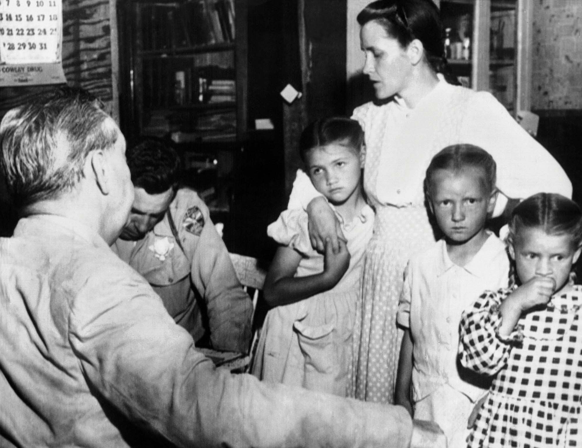 Mrs John Barlow and family, one of more than 100 adults of Short Creek Arizona arrested for polygamy in 1953 Mormon