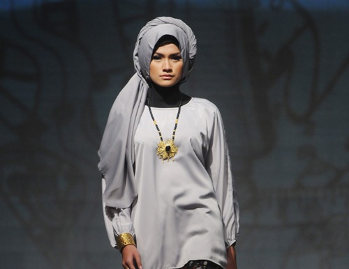 A model wears clothes designed by Cut Nyak during the Muslim Fashion Festival 2016 in Jakarta, Indonesia Modest fashion