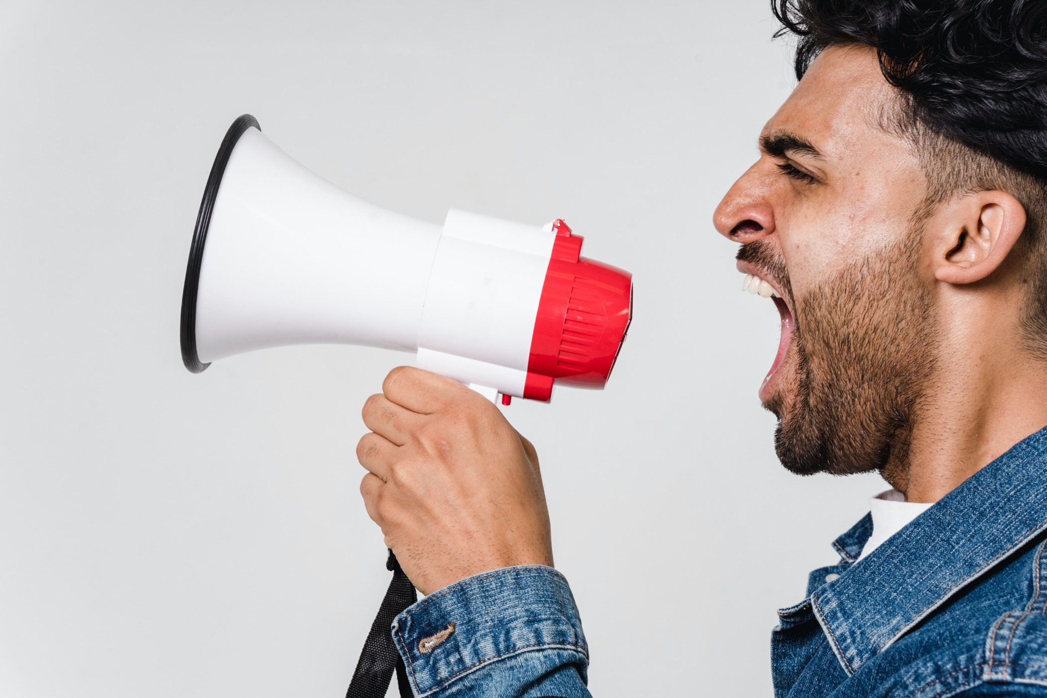 A man shouting into a megaphone